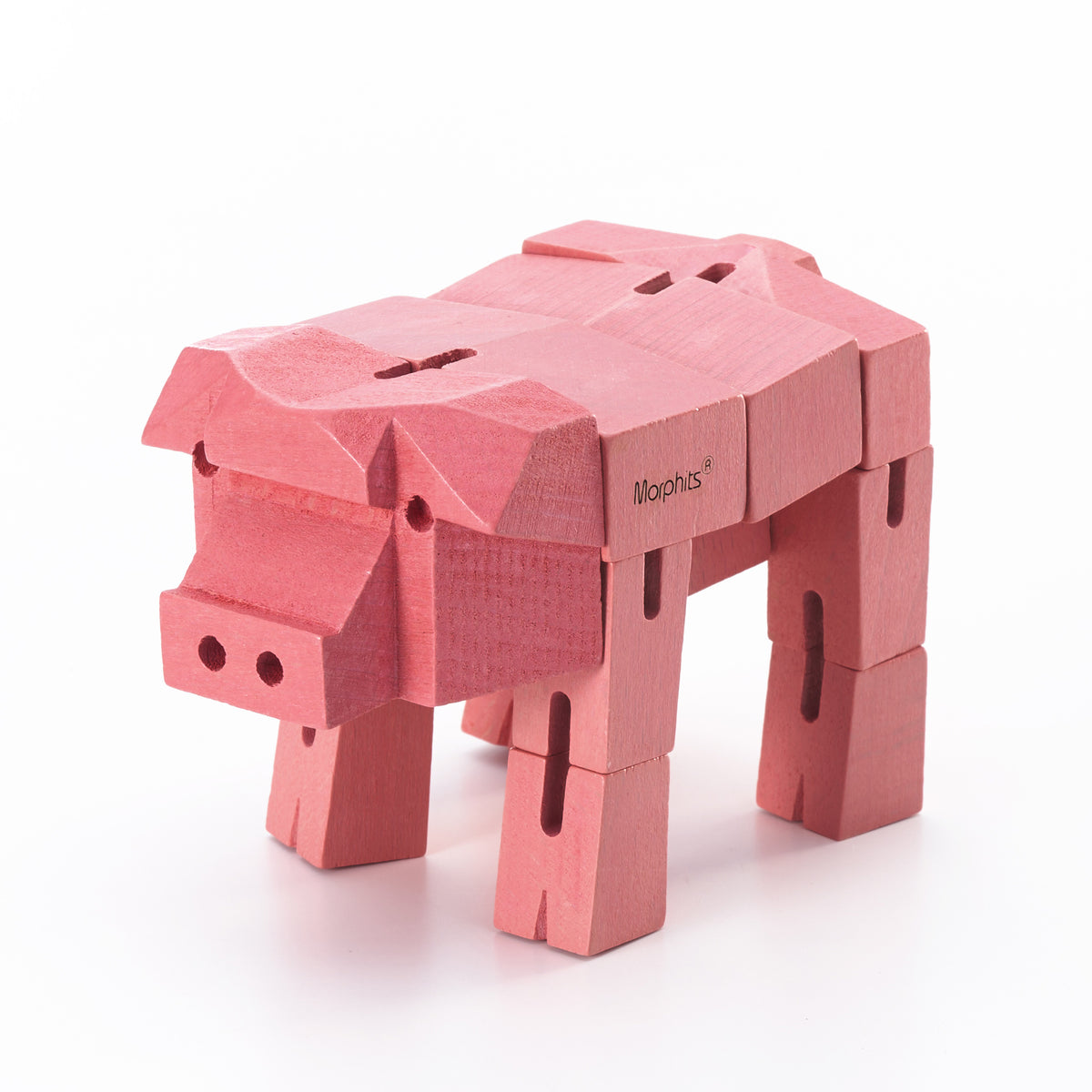 Morphits Pig transformable wooden design object in product photography.
